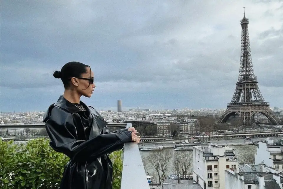 Zoë Kravitz in front of the Eiffel Tower in a Saint Laurent look