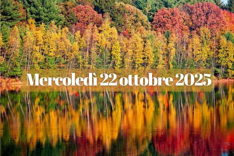 Paesaggio autunnale con alberi dai colori caldi riflessi su un lago, simbolo del 22 ottobre 2025