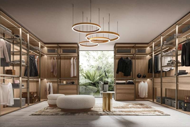 Cabina armadio Kico su misura con arredi in legno, illuminazione integrata e stile moderno